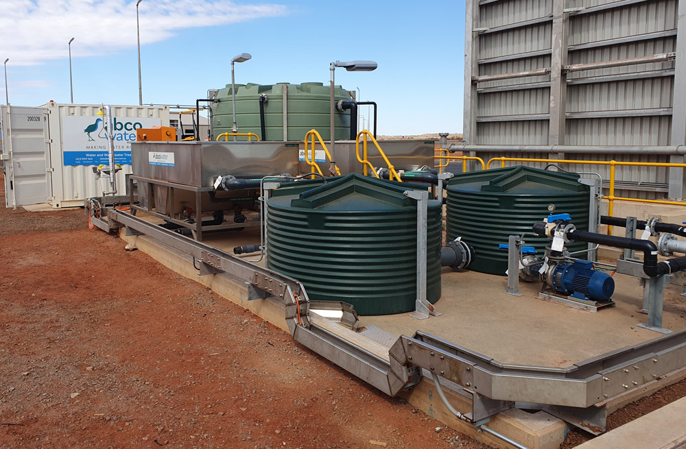 Abco Water Systems mining wash bay with Fox Environmental oil water separator and green water storage tank