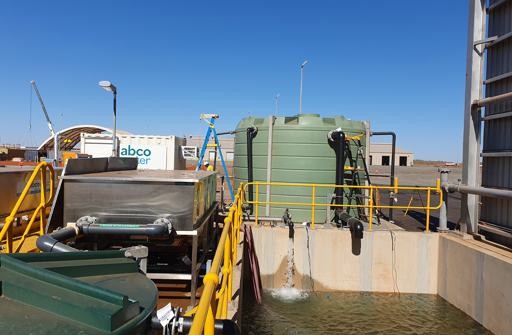Abco Water Systems mining wash bay with Fox Environmental oil water separator and green water storage tank