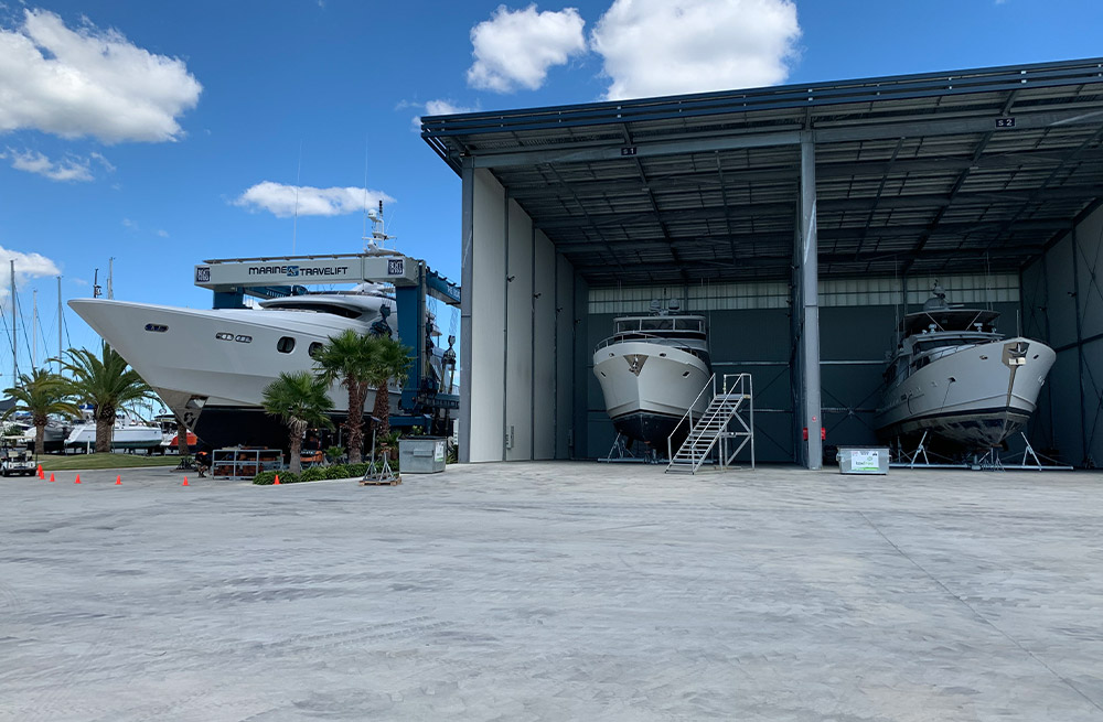 Large yacht in Marine Travelift at The Boat Works marina boatyard